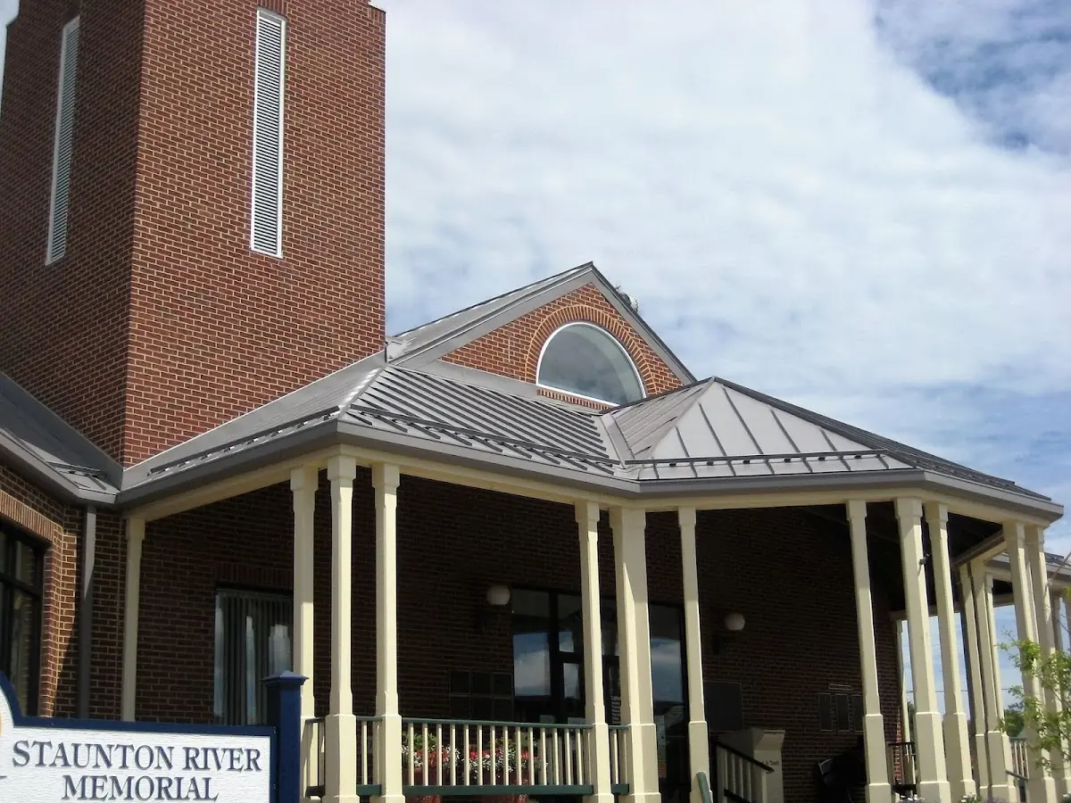 Skilled roofing craftsmen working on a residential roof in East Providence